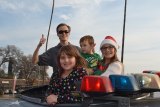 Volunteers Niko Valentino, Lauren Olson, Riley Giles and Talon Giles helped the Lemoore police and others deliver presents to local families as part of 'Presents on Patrol"